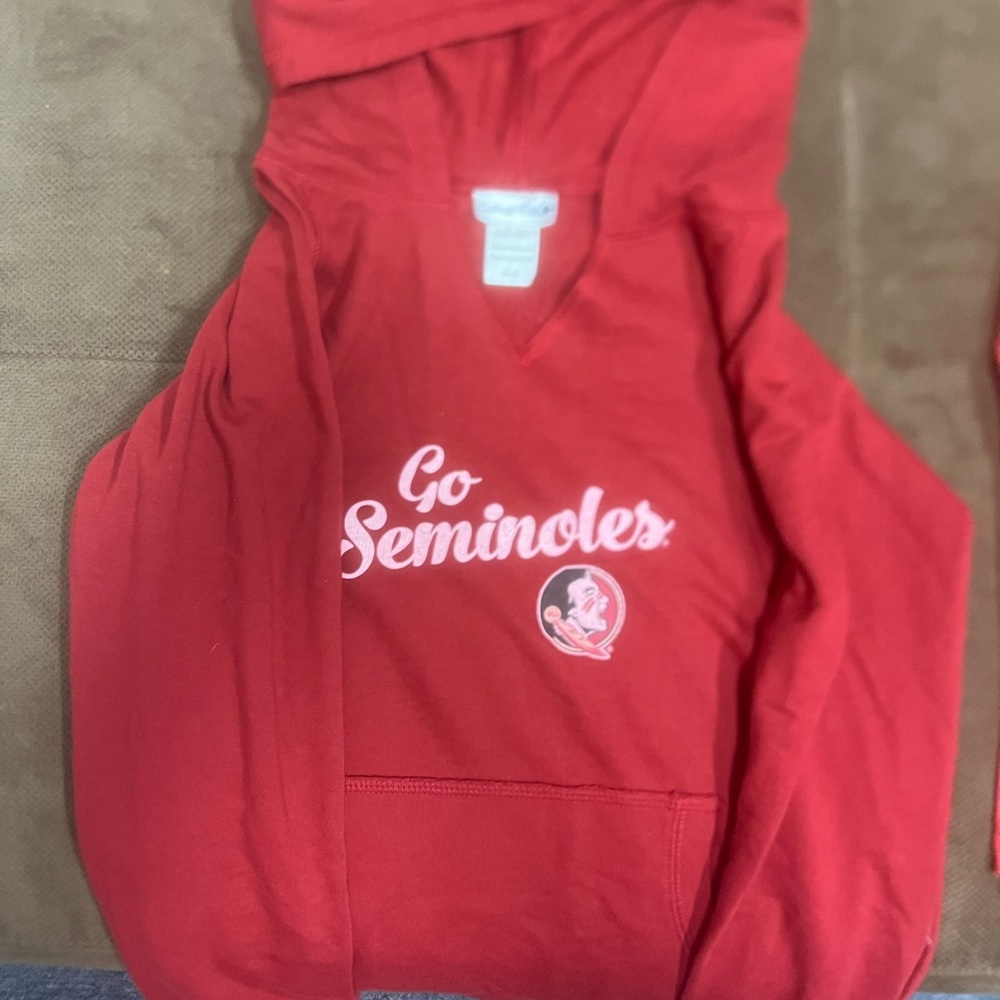 Miami Dolphins shirt size 8. The others are 10-12 / medium.